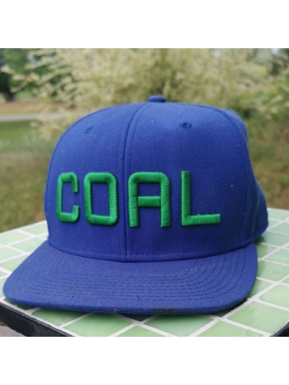 COAL headwear trucker hat with green writing. Adjustbable. Unisex